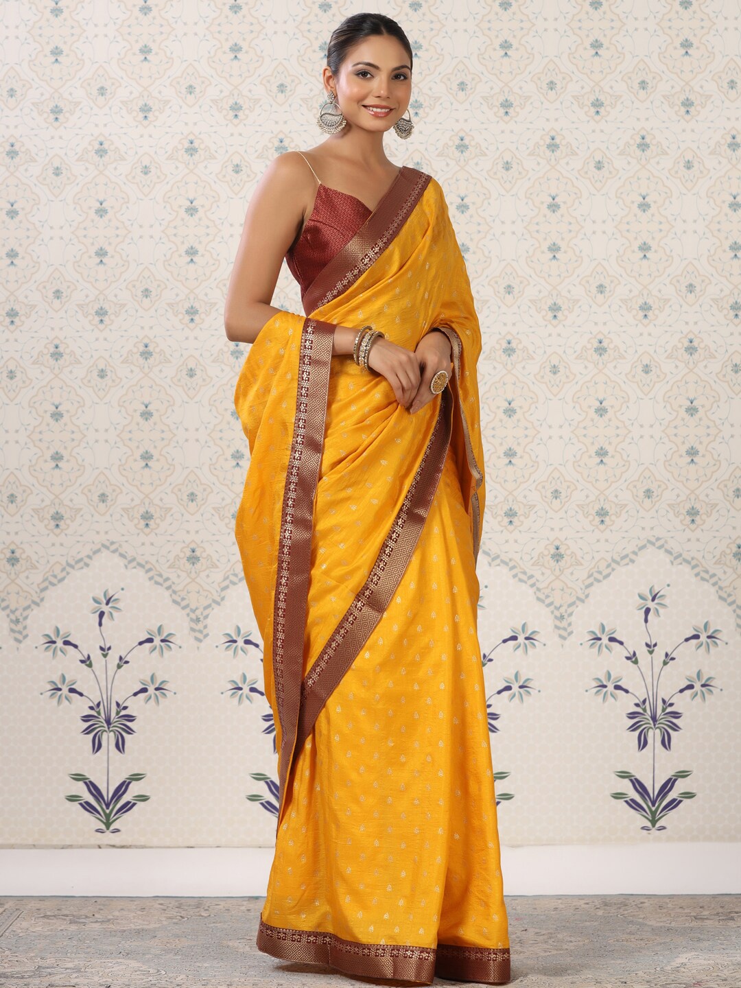 

Ode by House of Pataudi Mustard & Red Ethnic Printed Zari Saree