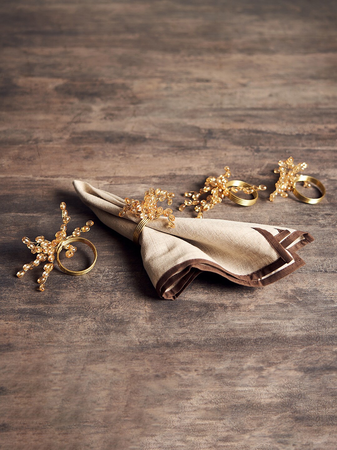 

Pure Home and Living 4 Pieces Gold -Toned Table Napkins Rings