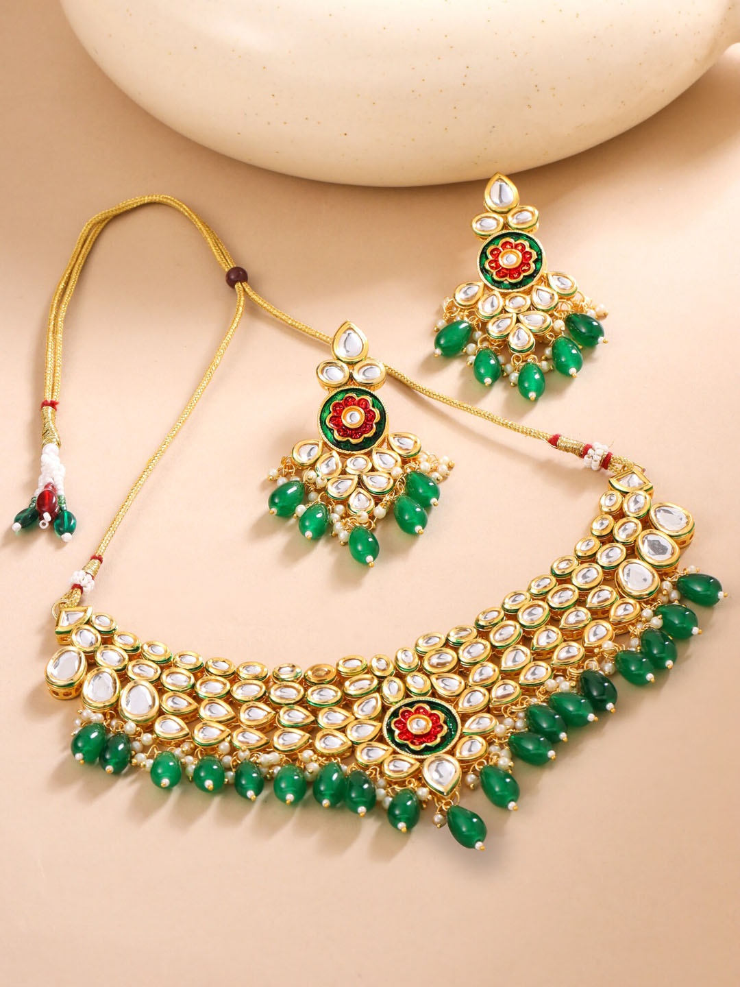 

Yellow Chimes Gold Plated Kundan-Studded & Beaded Jewellery Set