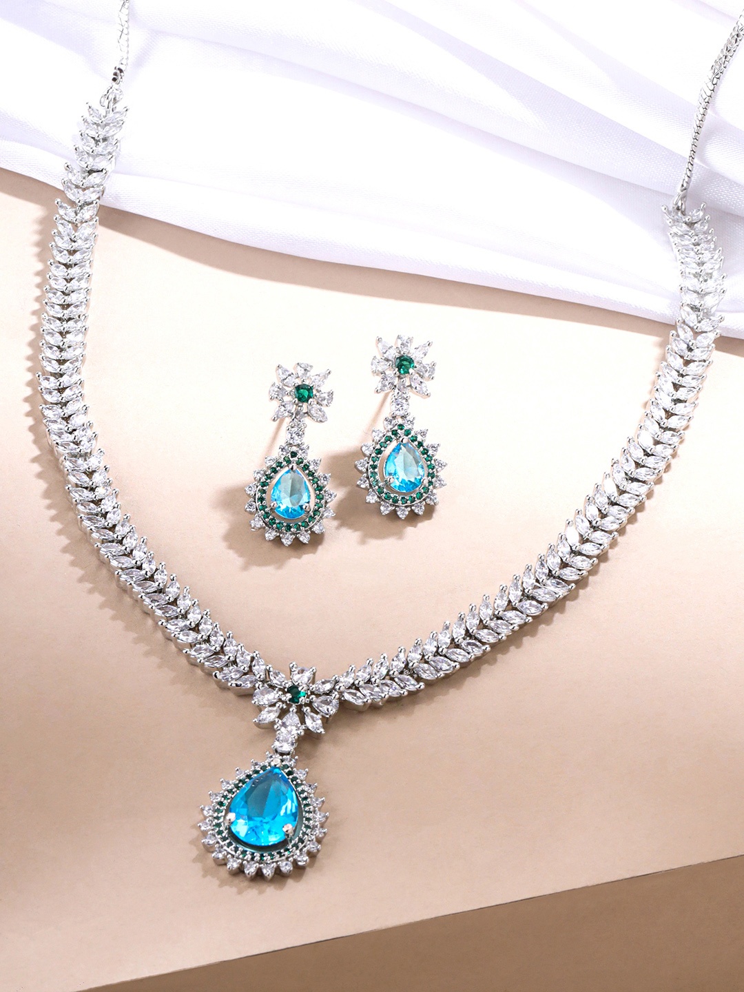 

Yellow Chimes Rhodium Plated American Diamond Studded Jewellery Set, Silver