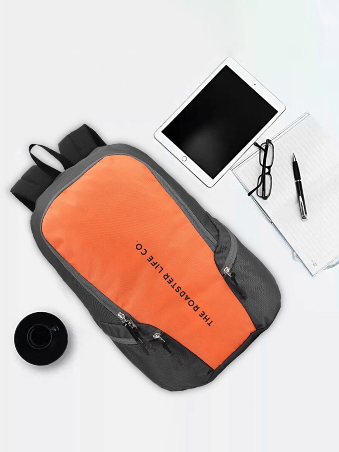 

The Roadster Lifestyle Co. Orange Printed Medium Waterproof Backpack