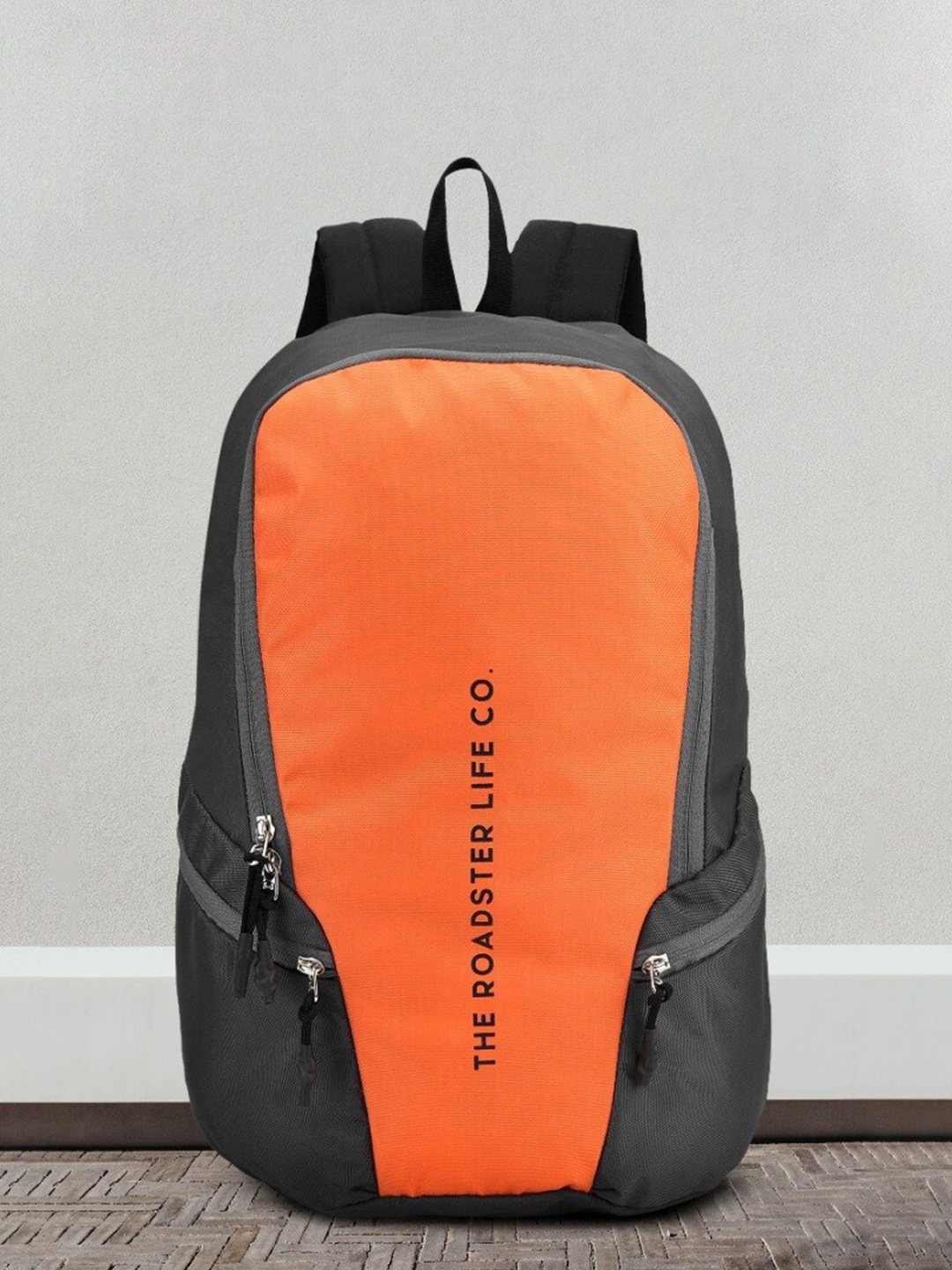 

The Roadster Lifestyle Co. Orange Printed Medium Waterproof Backpack