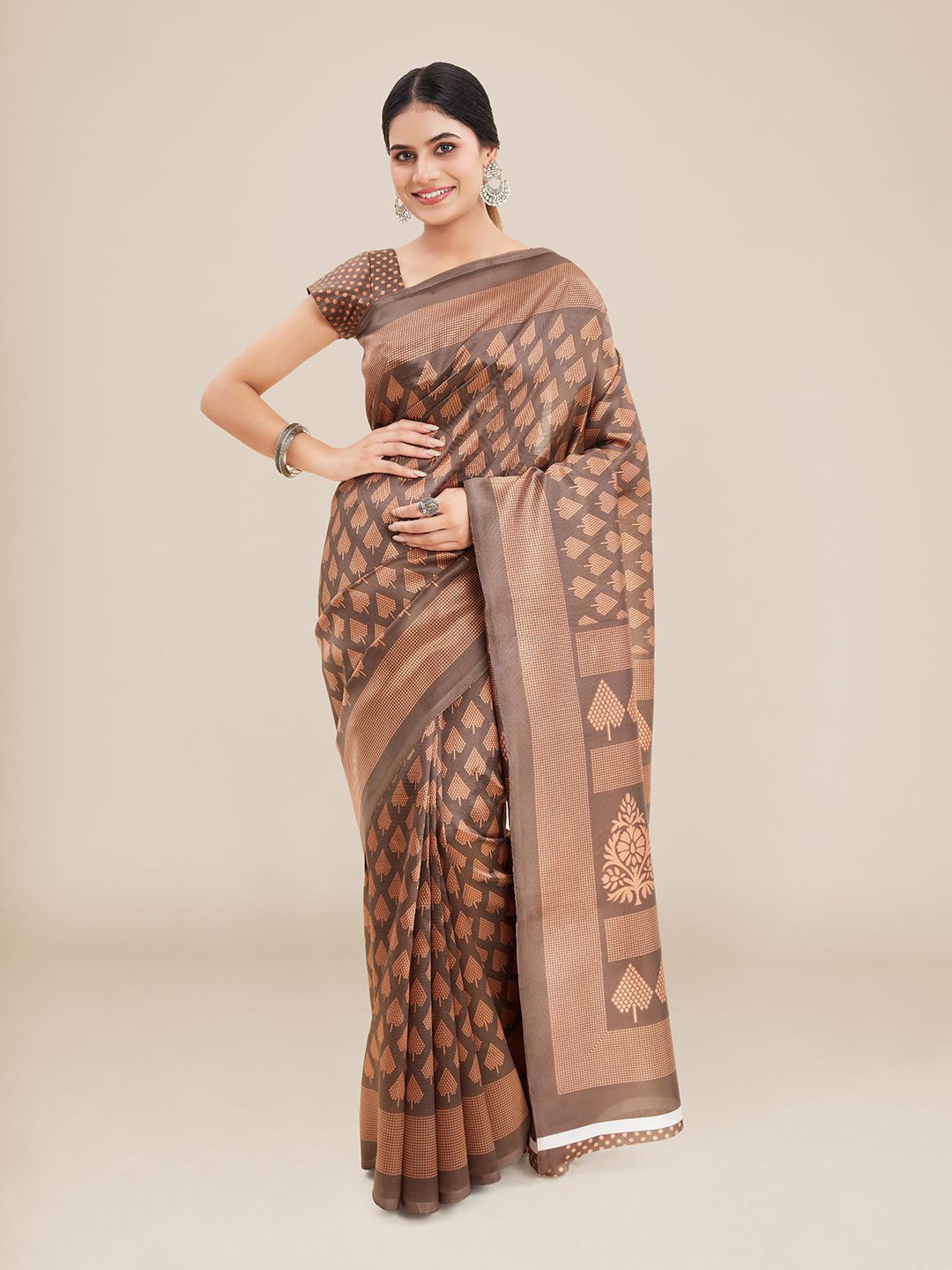 

Kalyan Silks Brown Ethnic Motifs Silk Blend Ikat Saree