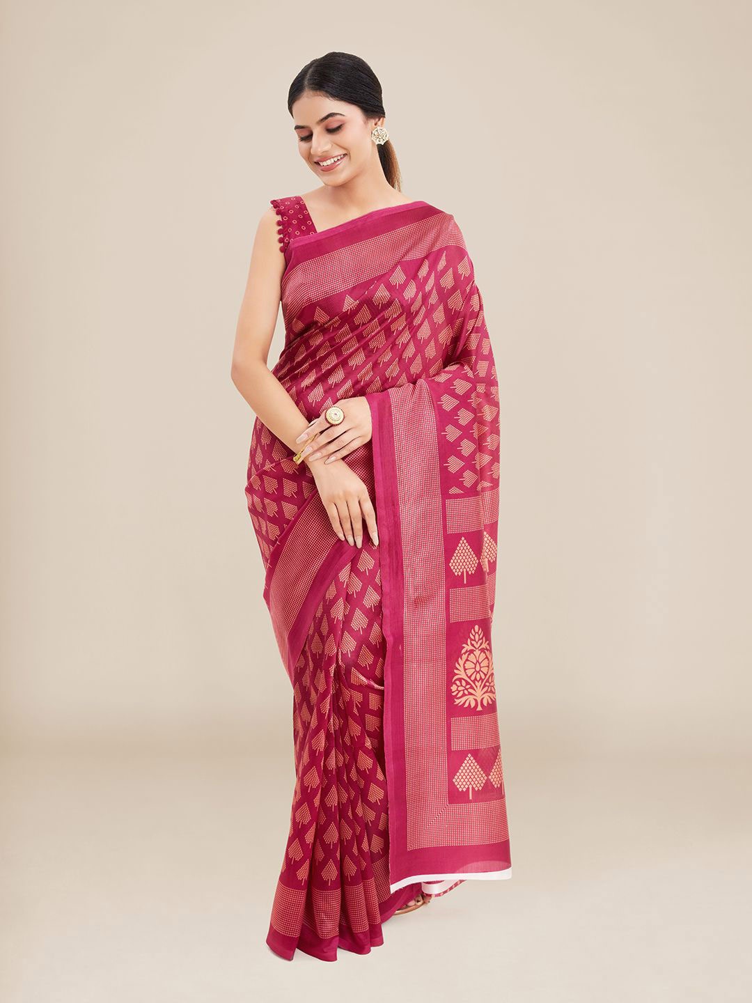 

Kalyan Silks Pink & Beige Ethnic Motifs Art Silk Ikat Saree