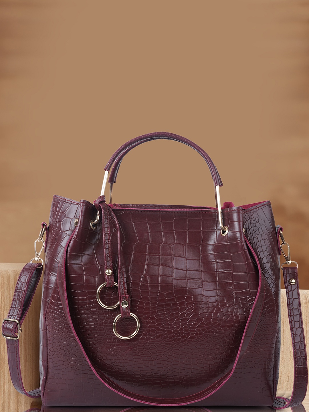 

DressBerry Maroon Textured Structured Handheld Bag With Tasselled