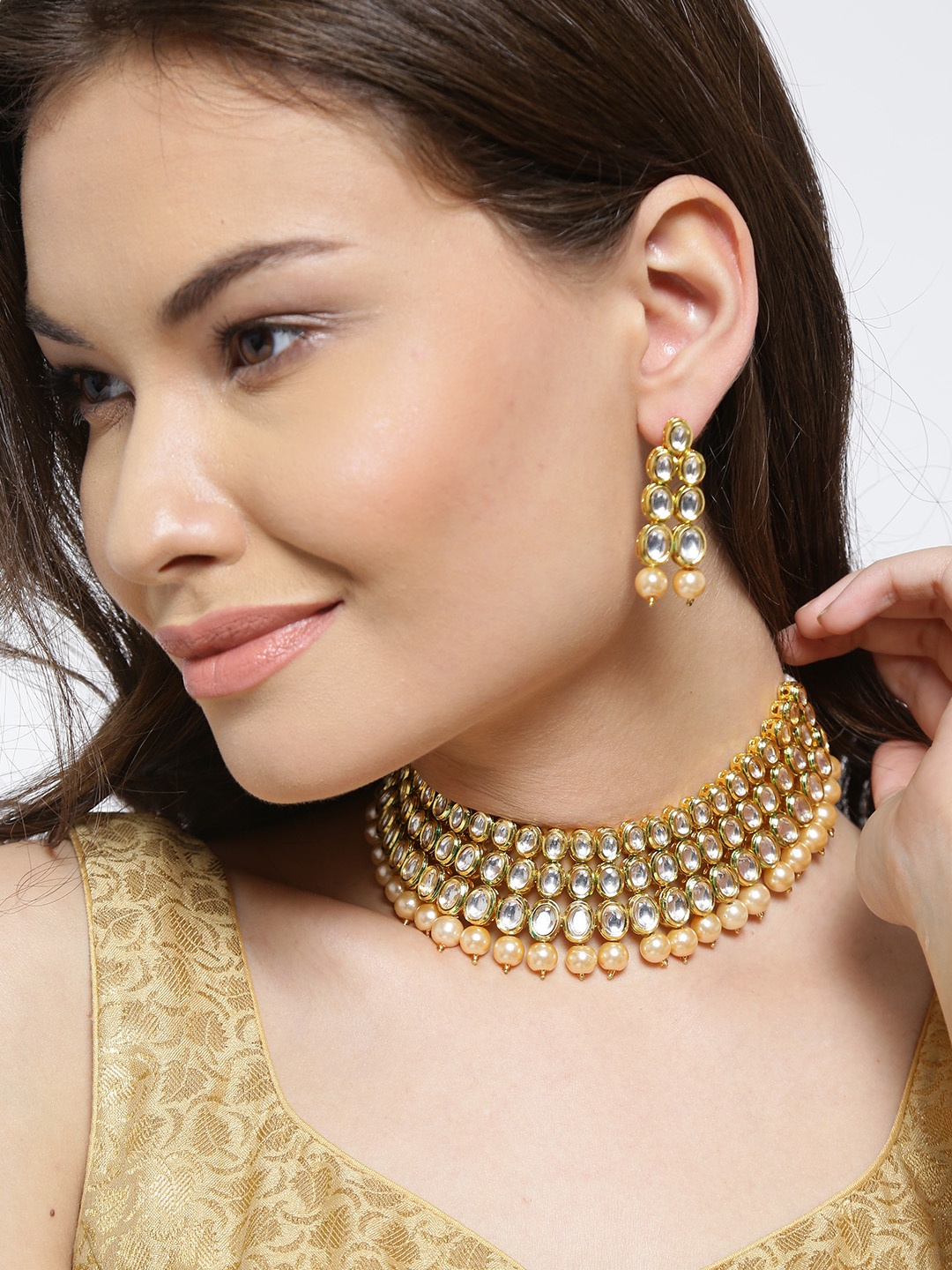 

YouBella Gold-Toned & Off-White Kundan Stone-Studded Beaded Jewellery Set