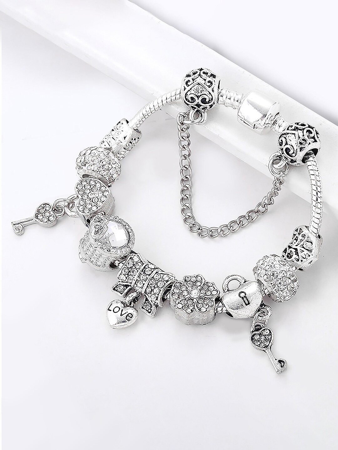 

Peora Silver-Plated Cubic Zirconia Studded Charm Bracelet