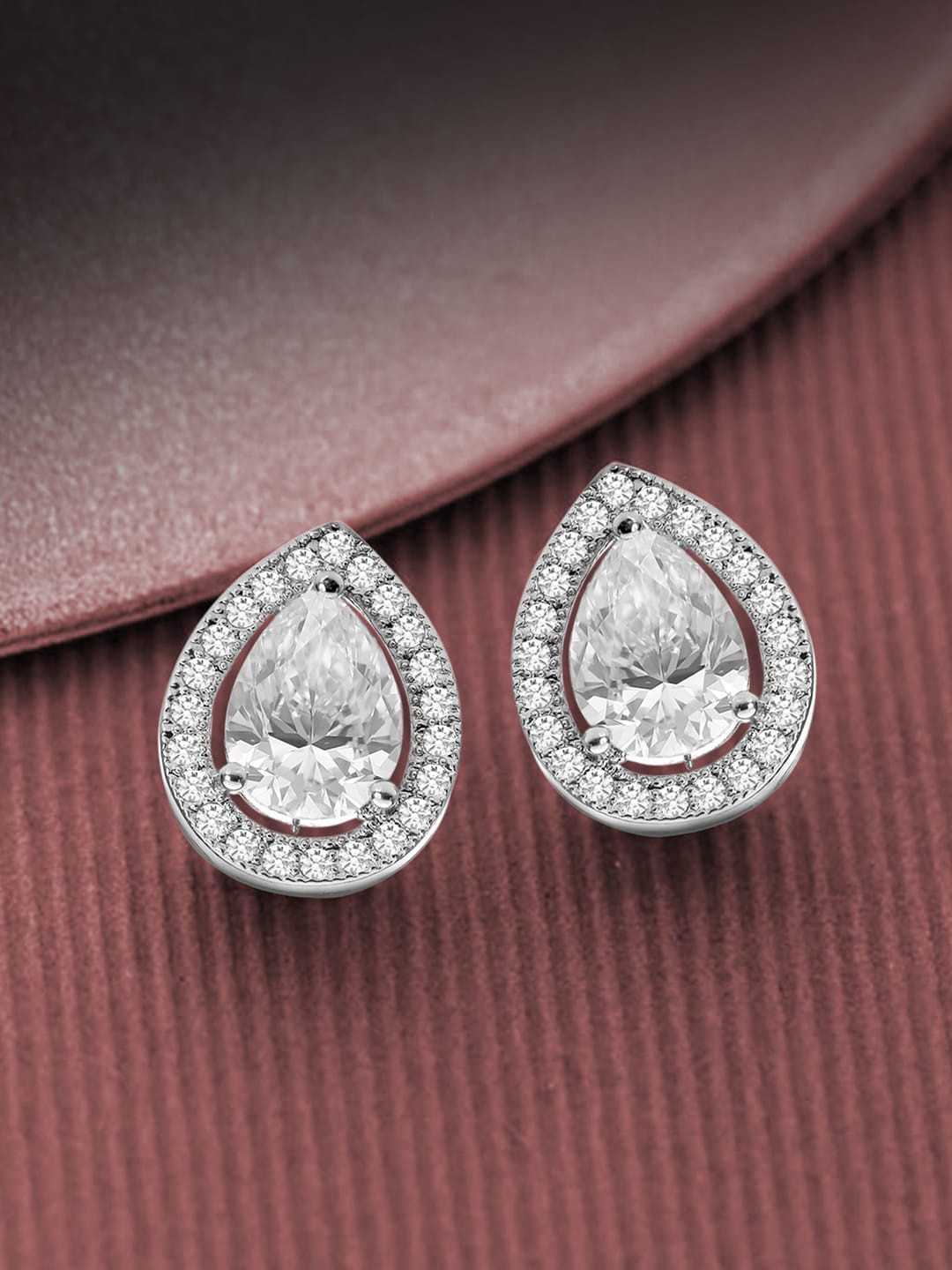 

Peora Silver-Plated Teardrop Shaped American Diamond Studded Studs Earrings