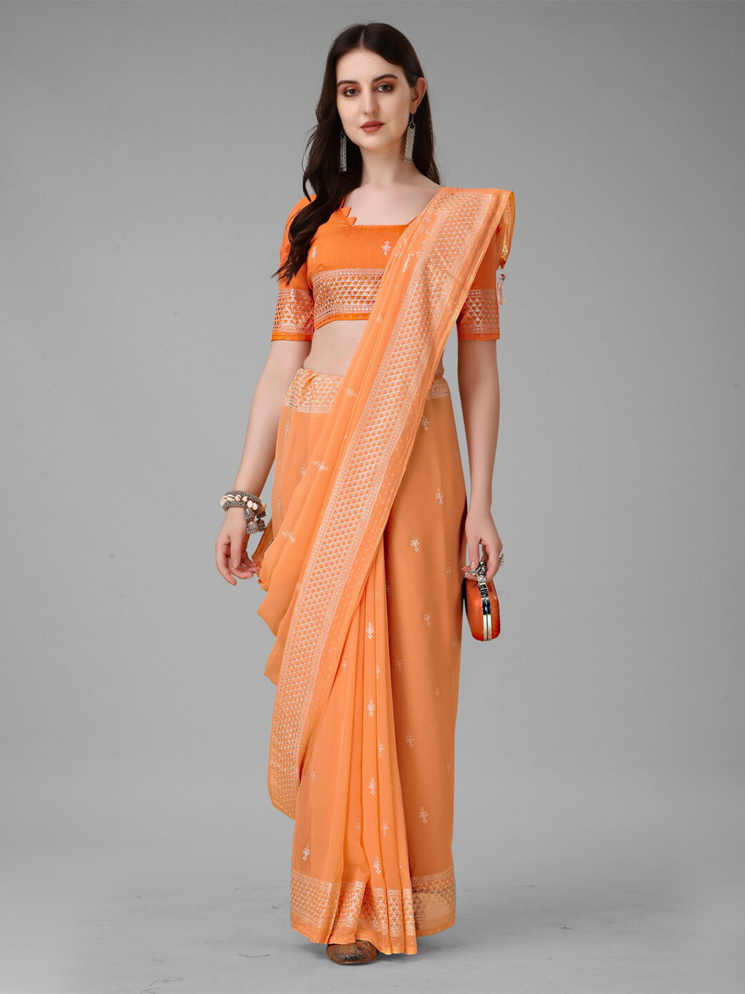 

Anouk Orange & Silver-Toned Ethnic Motifs Embroidered Pure Georgette Saree