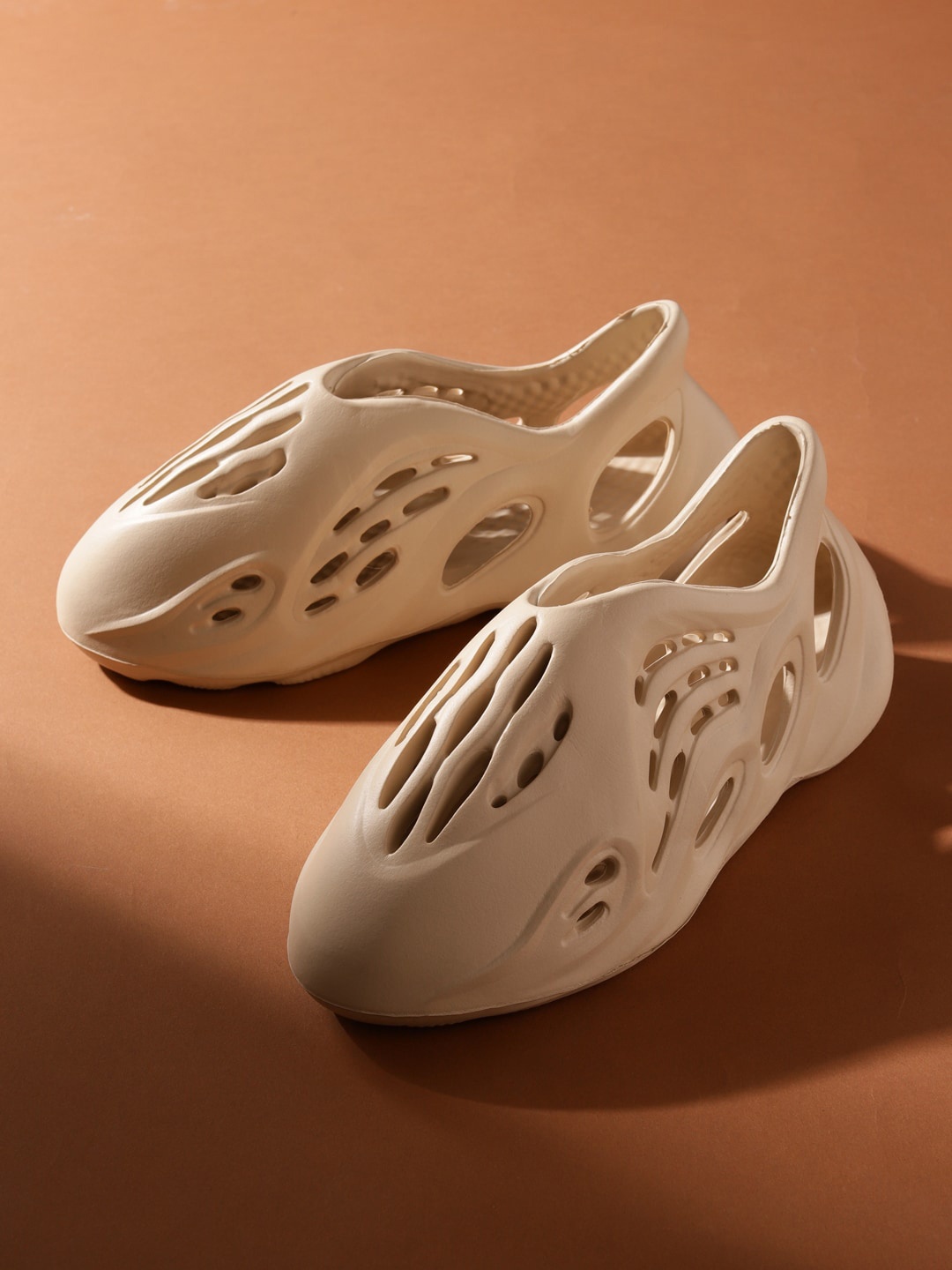 

Truffle Collection Women Basics Slip-On Sneakers With Laser Cuts, Beige