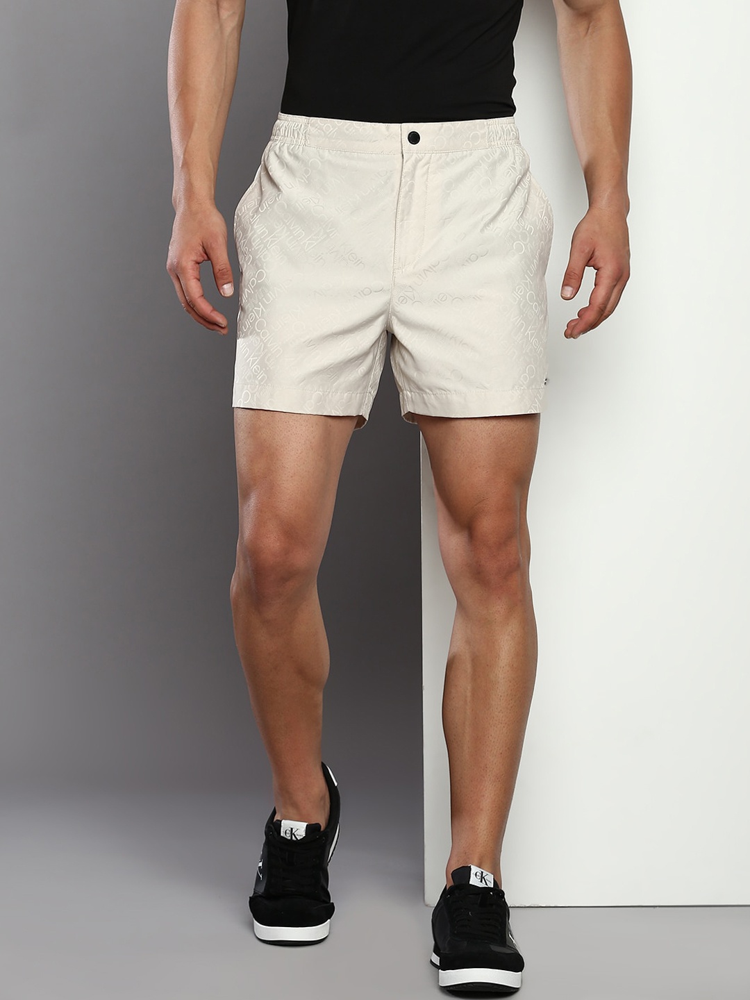 

Calvin Klein Jeans Men Typography Printed Regular Shorts, Beige