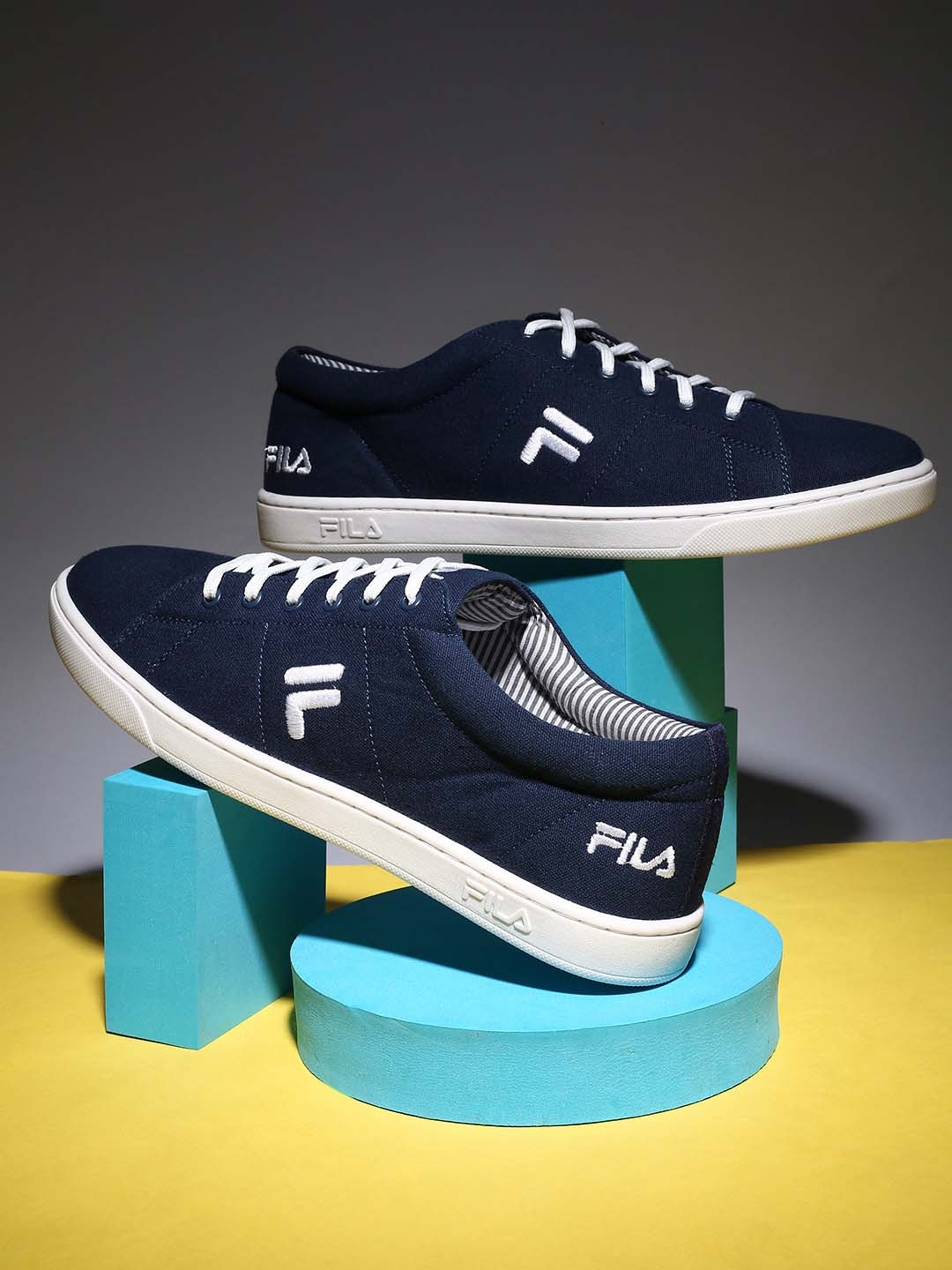 

FILA Men EZIOTA Memory Foam Canvas Contrast Sole Sneakers, Navy blue