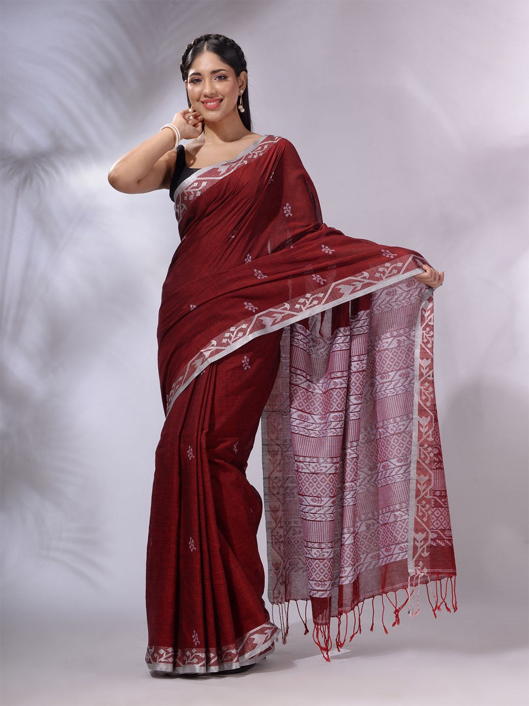 

Charukriti Tasseled Ethnic Motifs Woven Design Pure Cotton Saree, Maroon