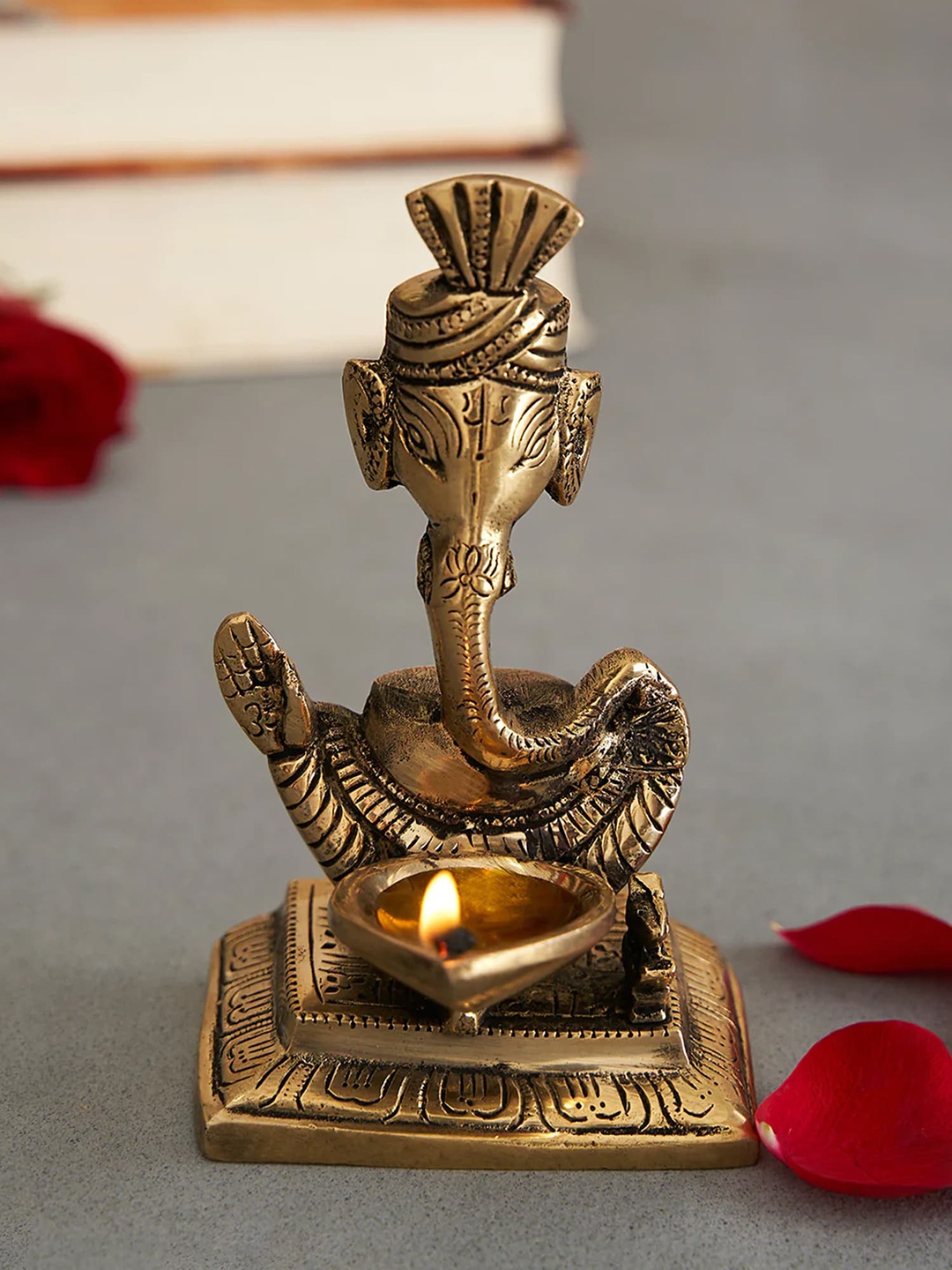 

DecorTwist Gold Toned Ganesha Diya Brass Showpiece