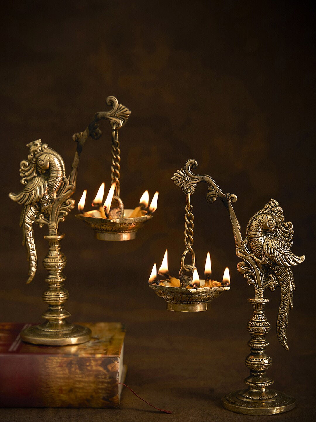 

DecorTwist Gold Toned Textured Annapakshi Diya Figurine Showpiece