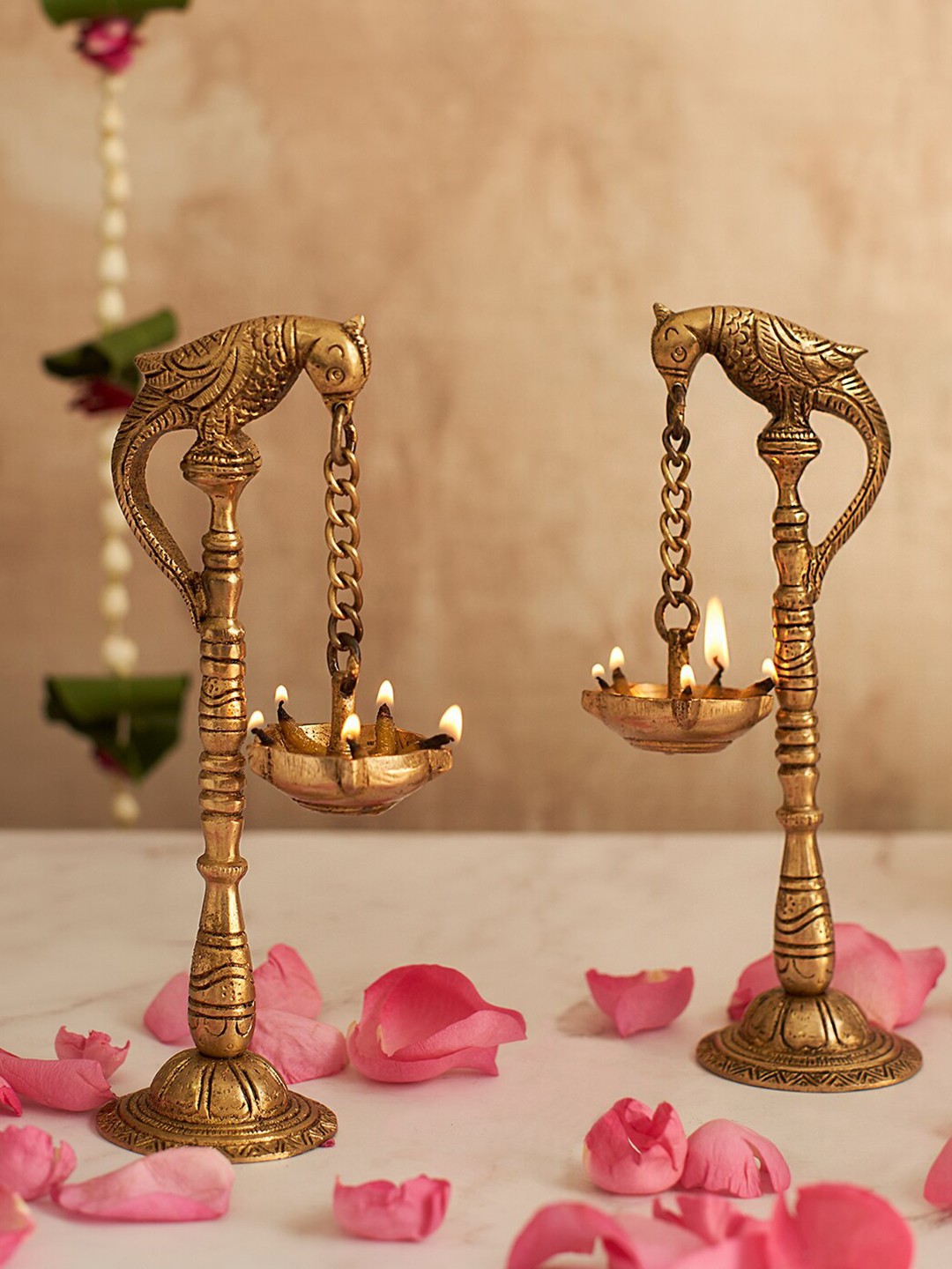 

DecorTwist Gold Toned 2 Pieces Brass Parrot Design Hanging Diyas