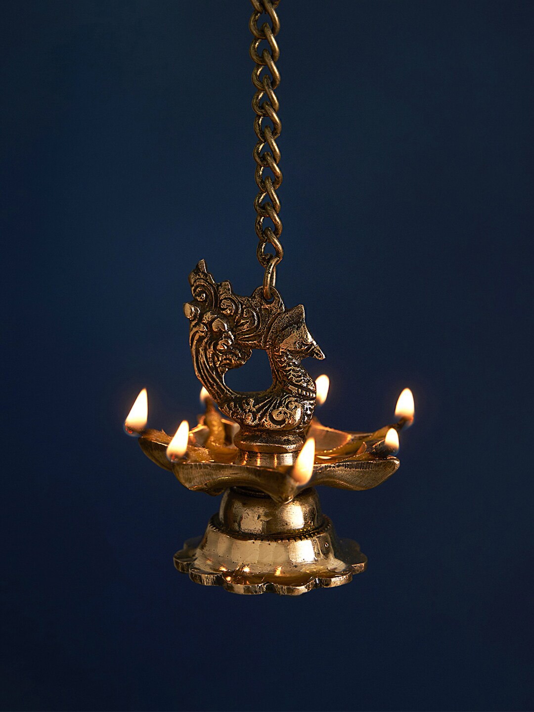 

DecorTwist Gold Toned 2 Pieces Brass Peacock-Shaped Hanging Diya
