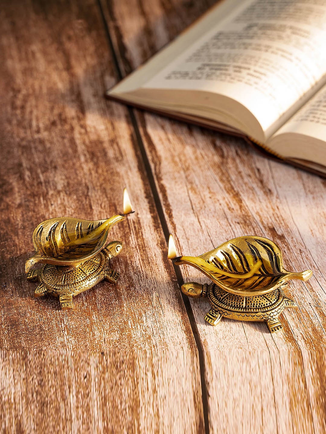 

DecorTwist Gold Toned 2 Pieces Tortoise Leaf Diyas