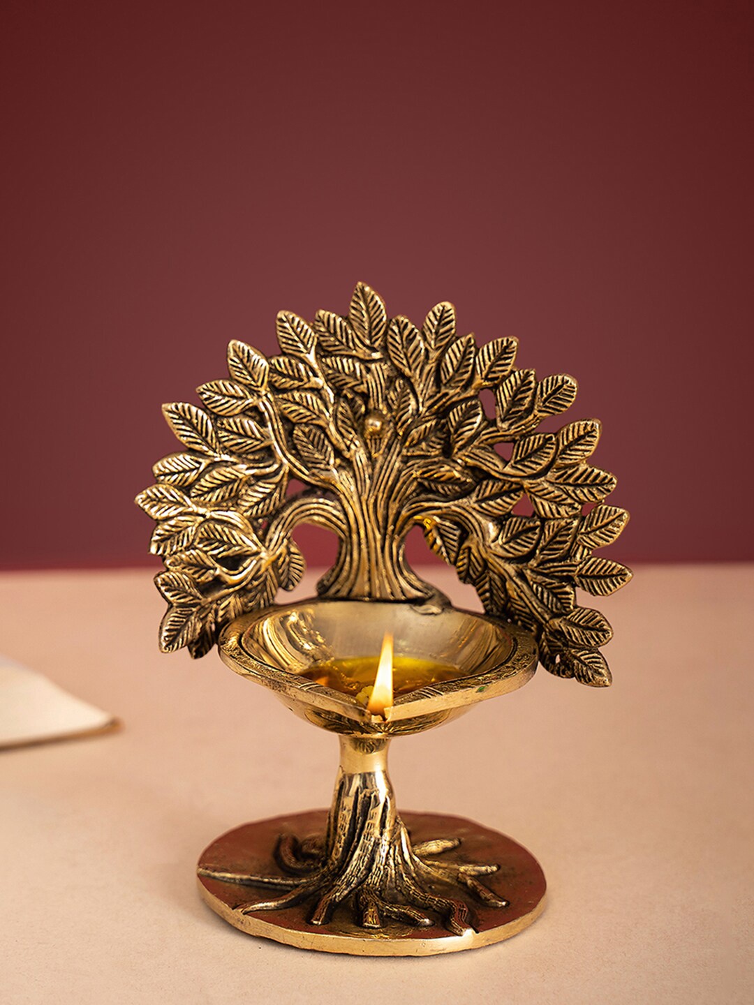 

DecorTwist Gold-Toned Brass Diya With Stand