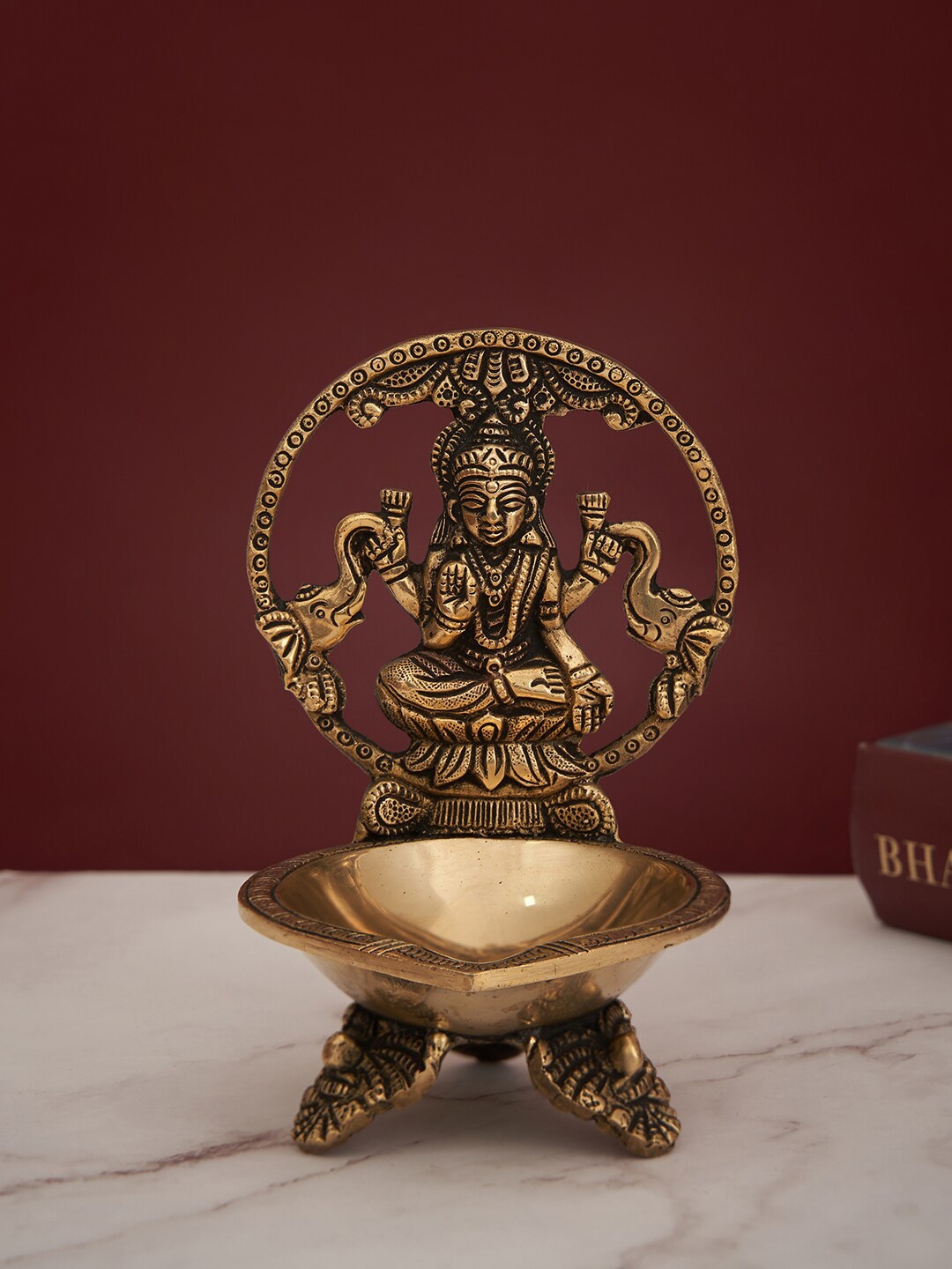 

DecorTwist Gold-Toned Laxmi Brass Pooja Decorative Showpiece Diya