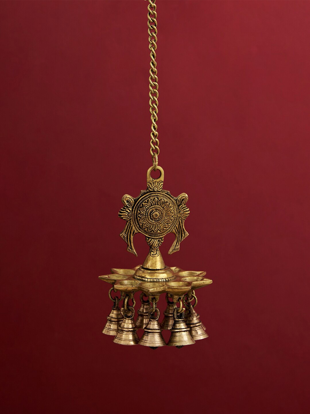 

DecorTwist Gold-Toned Hanging Diya In Lord Vishnu's Chakra