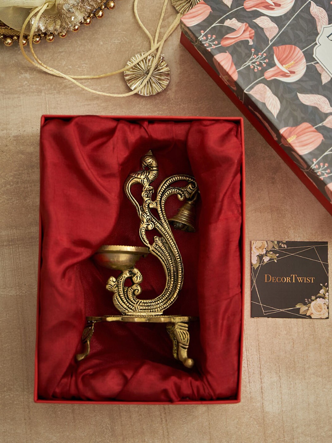 

DecorTwist Gold-Toned Peacock Design Brass Diya with Gift Box