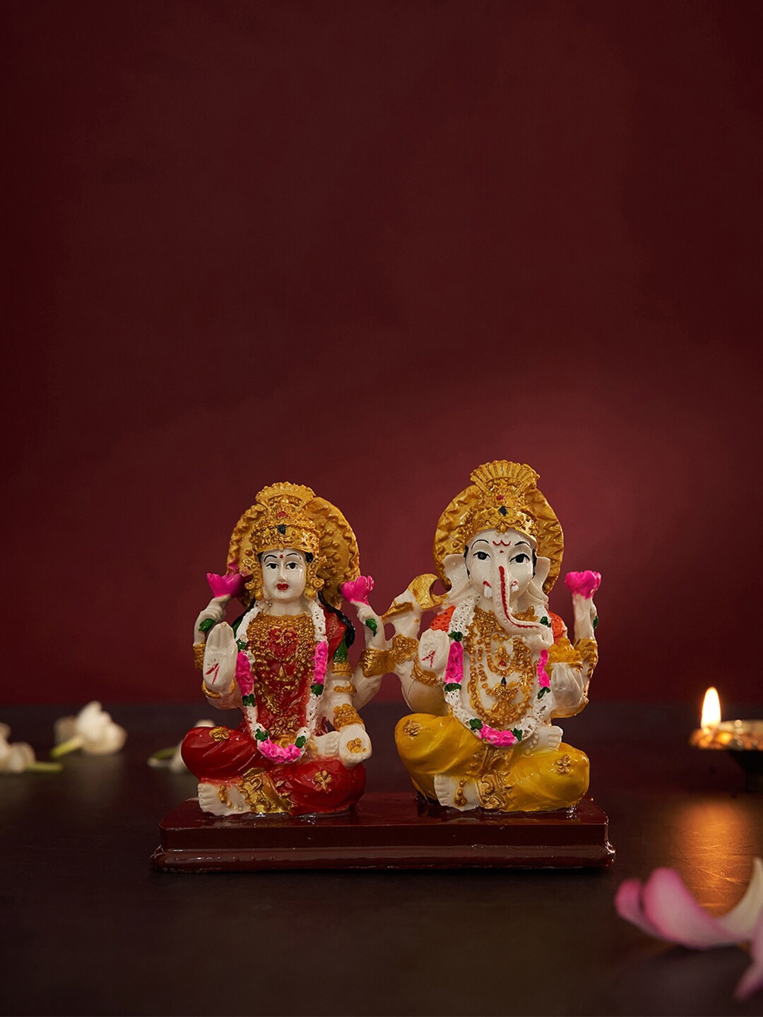 

DecorTwist White & Red Textured Lord Ganesha And Lakshmi Idol Showpiece