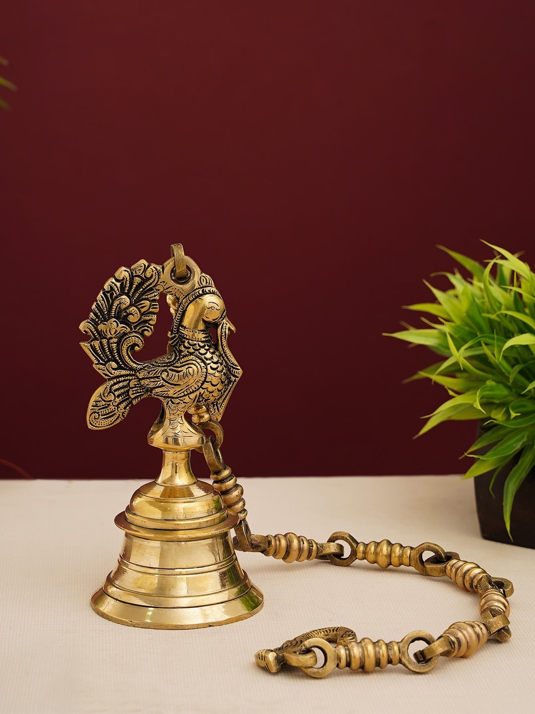 

DecorTwist Golden Peacock Shaped Temple Hanging Bell With Antique Finish, Gold