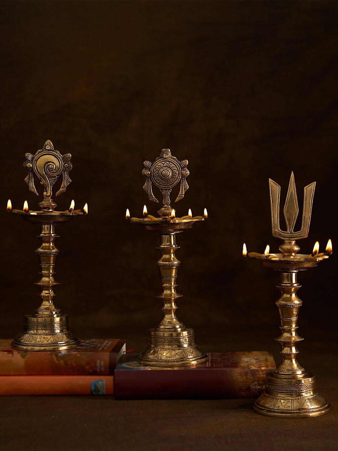 

DecorTwist Gold-Toned 3-Pieces Brass Vilakku Shank Chakra Nama Diya with Stand