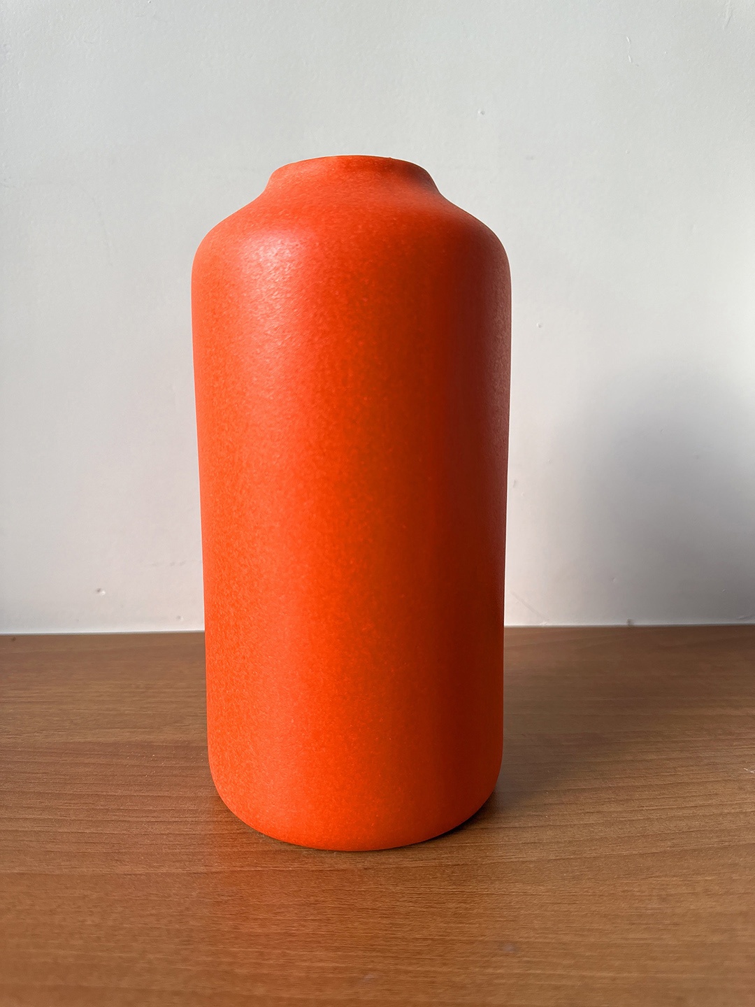 

CasaTrunk Orange-Colored Cylindrical Shaped Ceramic Vase