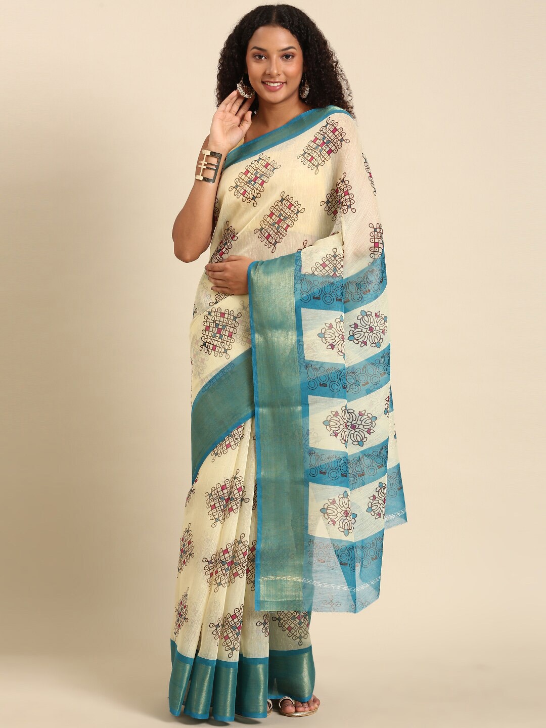 

Anouk Turquoise Blue & White Ethnic Motifs Zari Saree