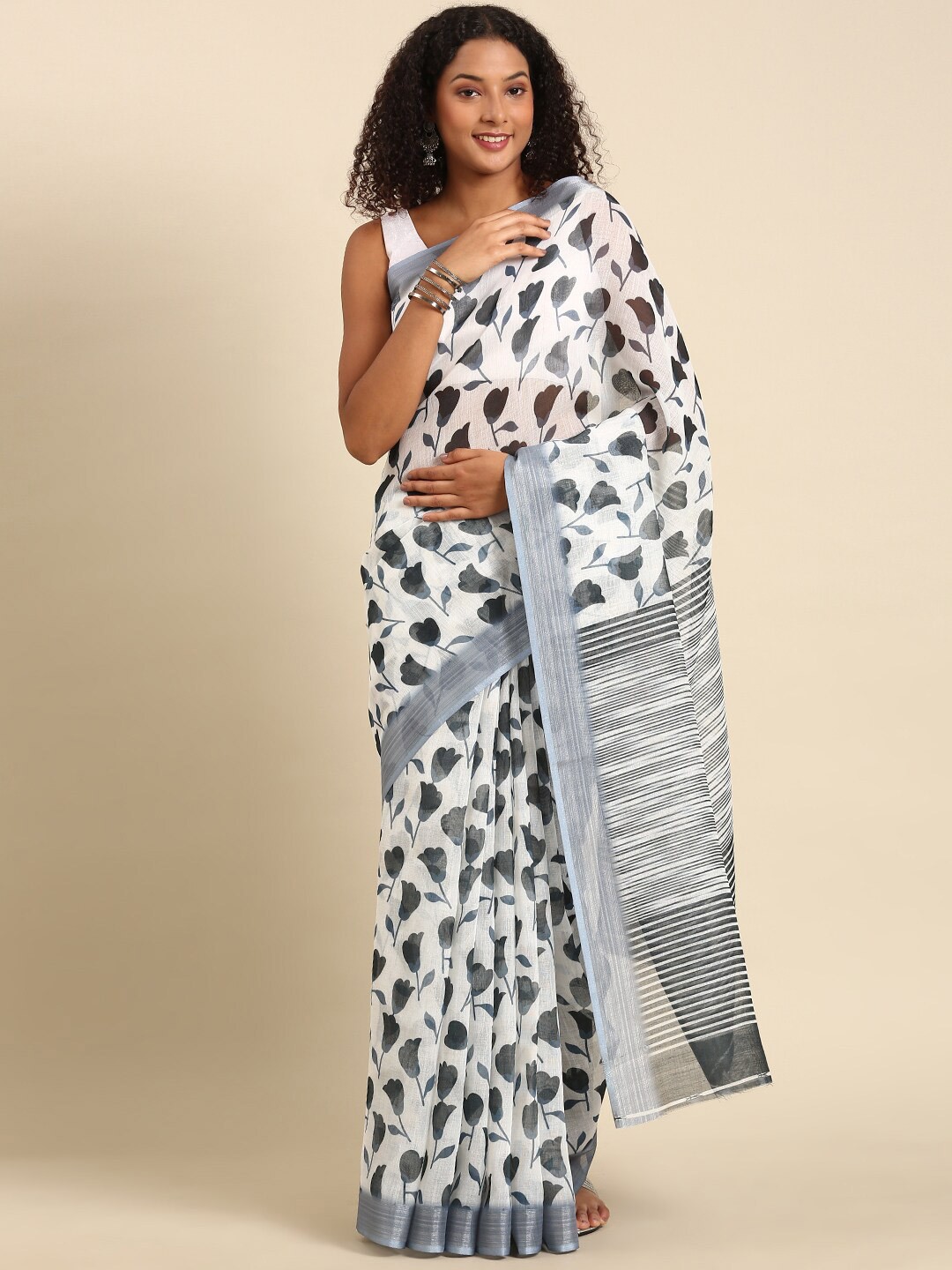 

Anouk White & Black Ethnic Motifs Zari Linen Blend Saree
