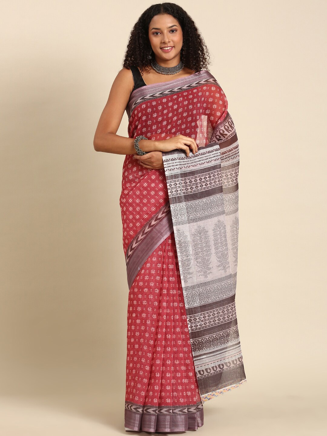

Anouk Maroon & White Ethnic Motifs Zari Saree