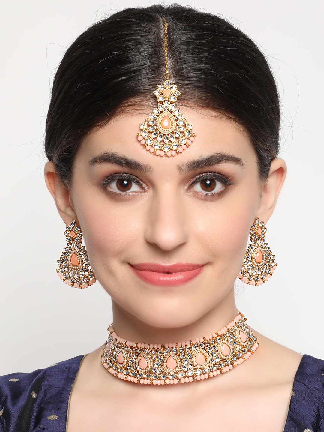 

Anouk Gold-Toned & Peach Gold-Plated Kundan-Studded & Beaded Jewellery Set