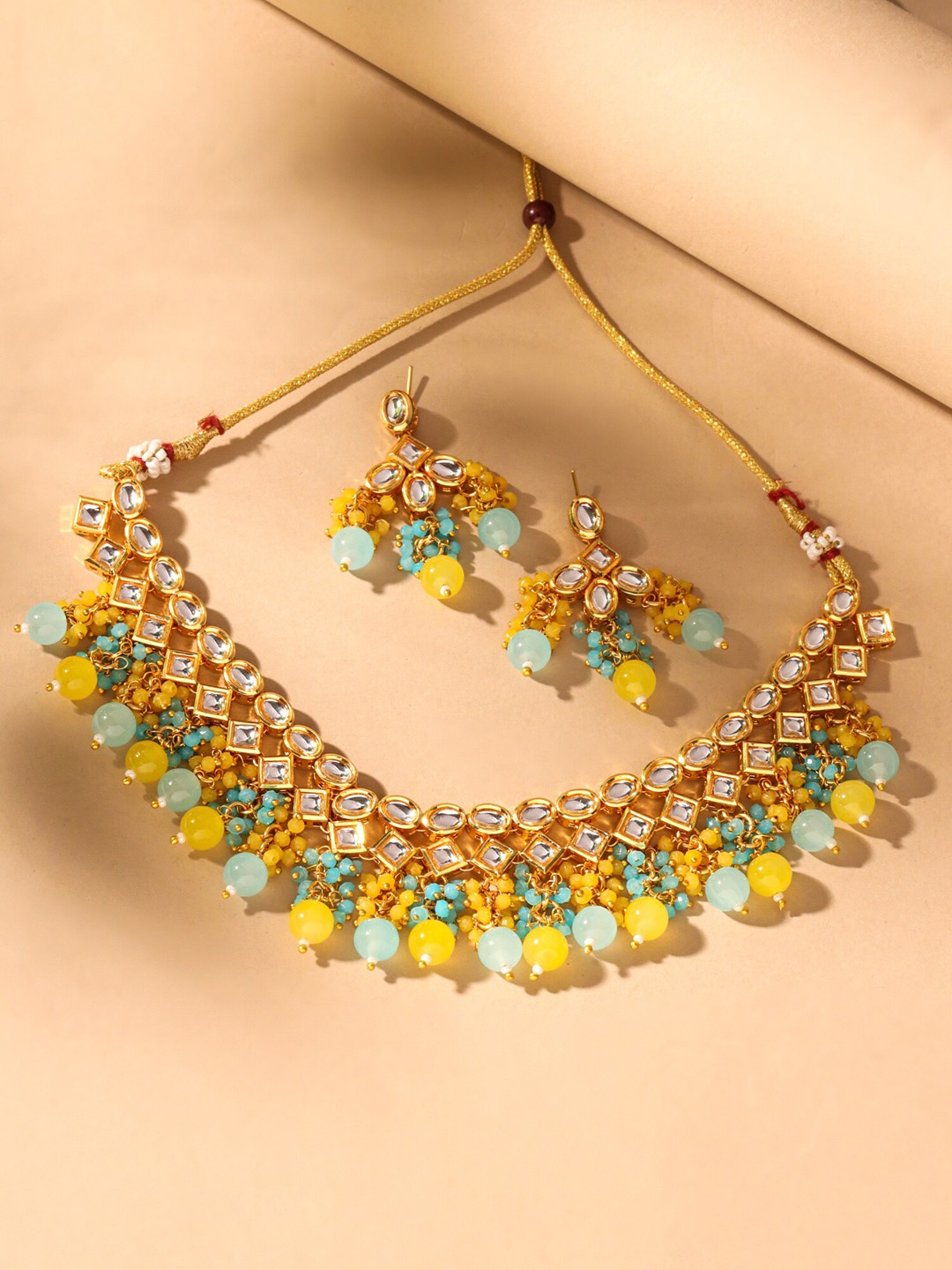 

Yellow Chimes Gold-Plated Kundan-Studded Jewellery Set