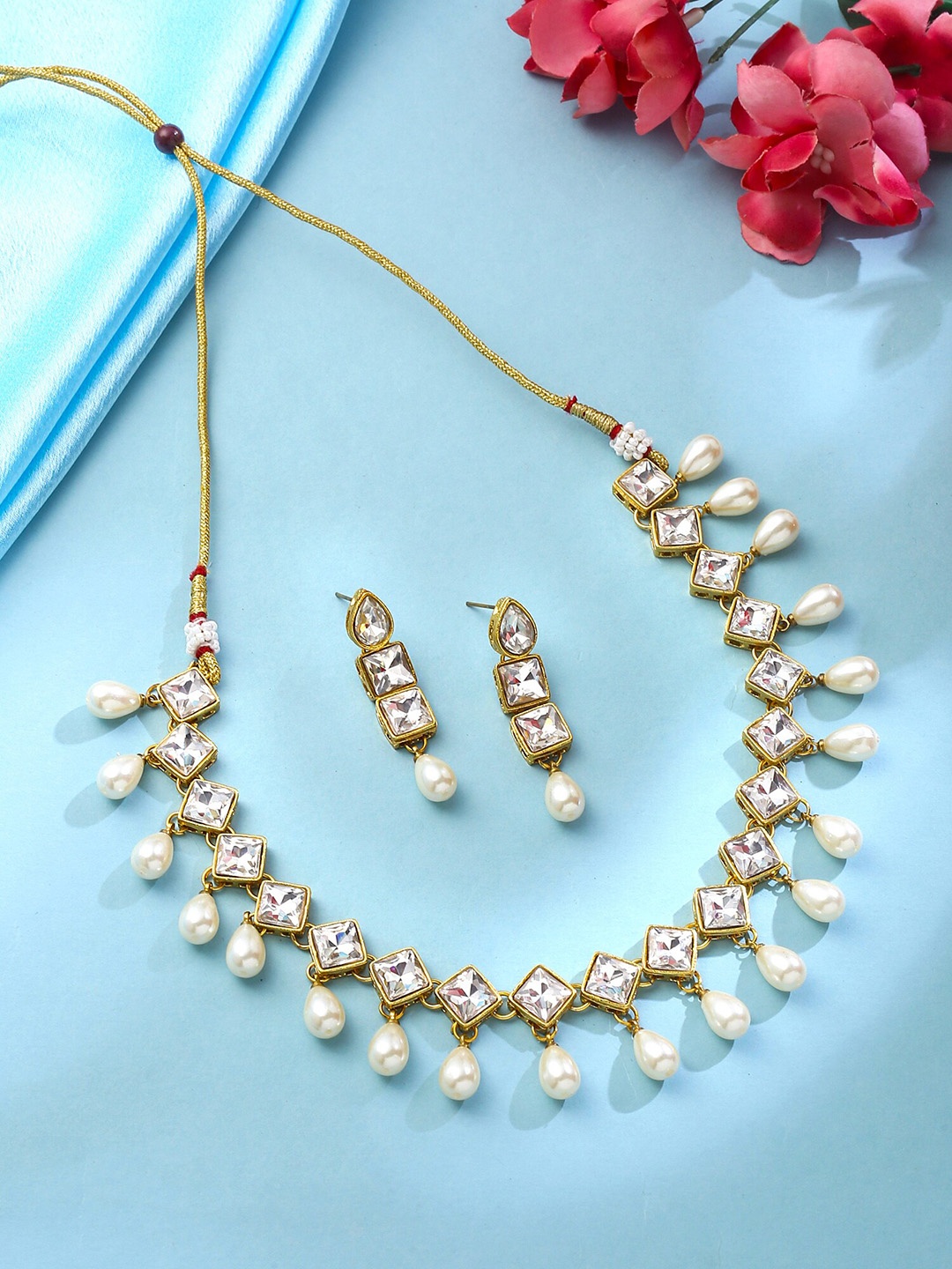 

Yellow Chimes Gold-Plated Kundan-Studded & Pearl Beaded Jewellery Set