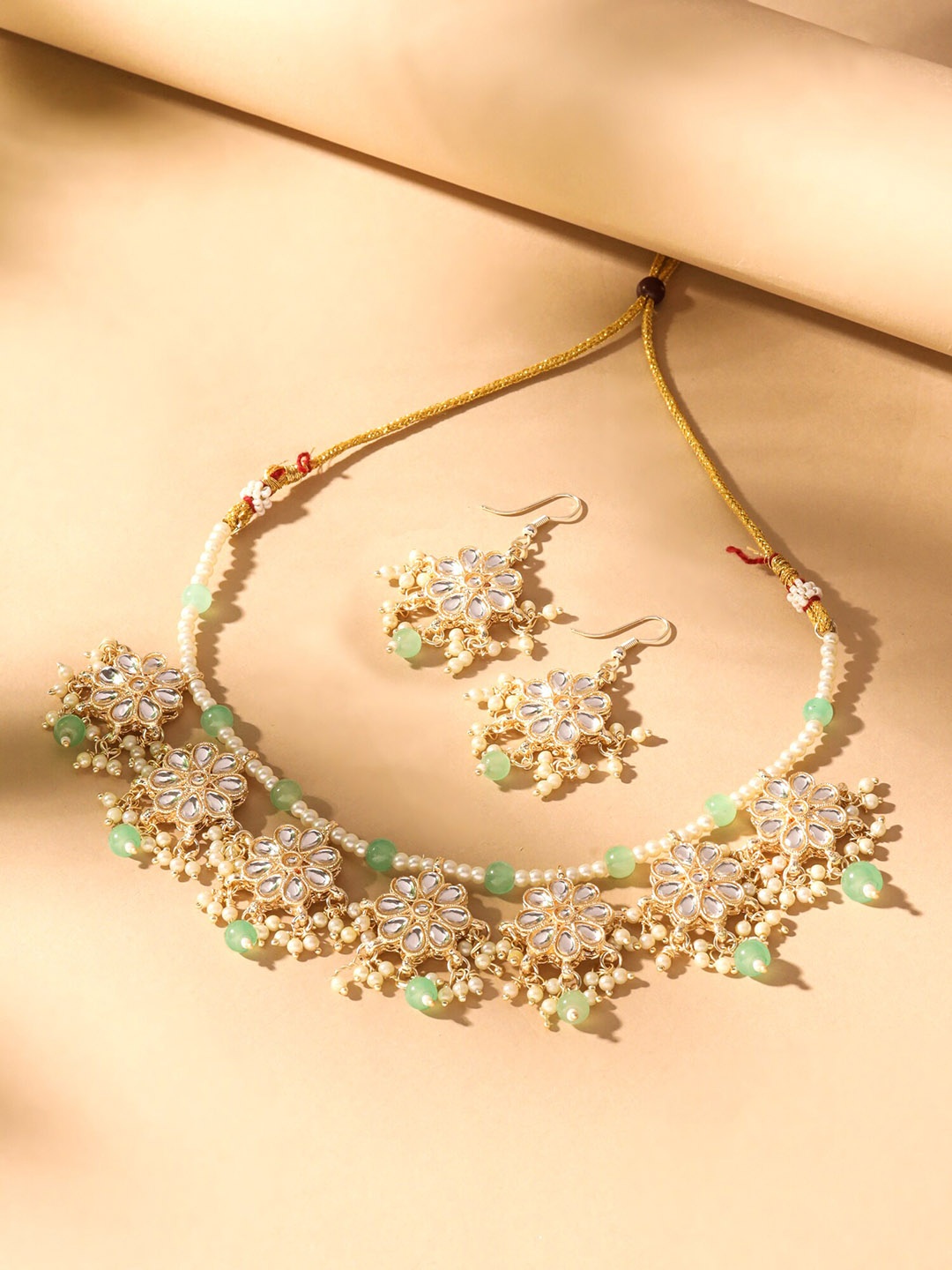 

Yellow Chimes Gold-Plated Kundan-Studded & Beaded Jewellery Set