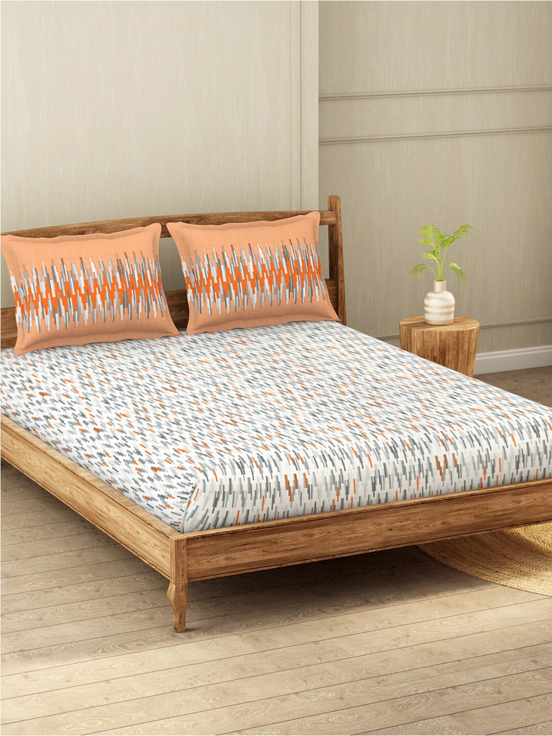 

Welspun White & Orange Geometric 200 TC Queen Bedsheet with 2 Pillow Covers