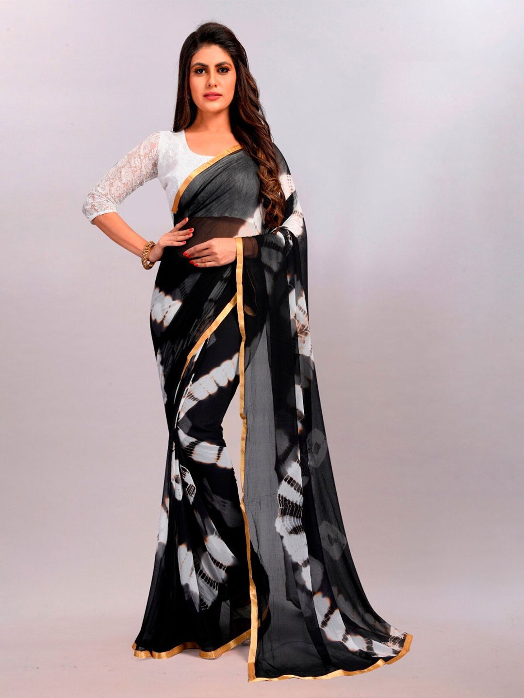 

APNISHA Black & White Tie and Dye Zari Leheriya Saree
