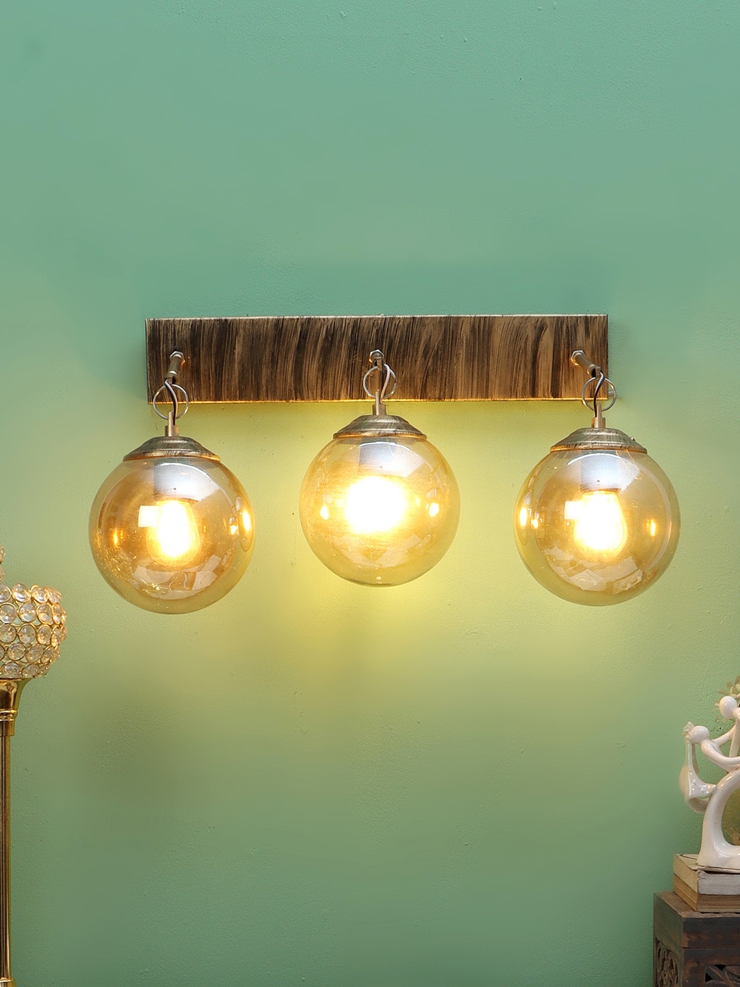 

MFD HOME FURNISHING Gold Toned Glass Wall Lamp With Metal Base
