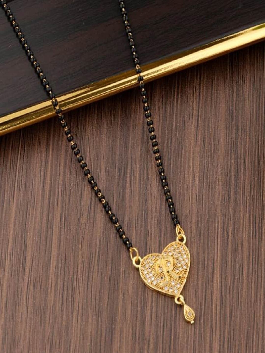 

JEWEL WORLD Gold-Plated Stone-Studded & Beaded Mangalsutra