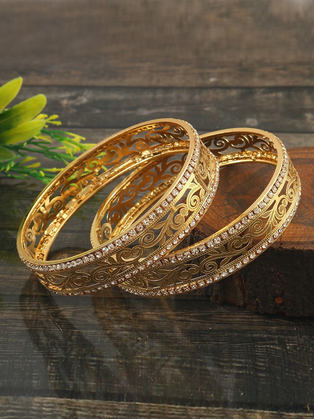 

Jewar Mandi Set Of 2 Gold-Plated AD Stone-Studded & Etching Textured Bangles