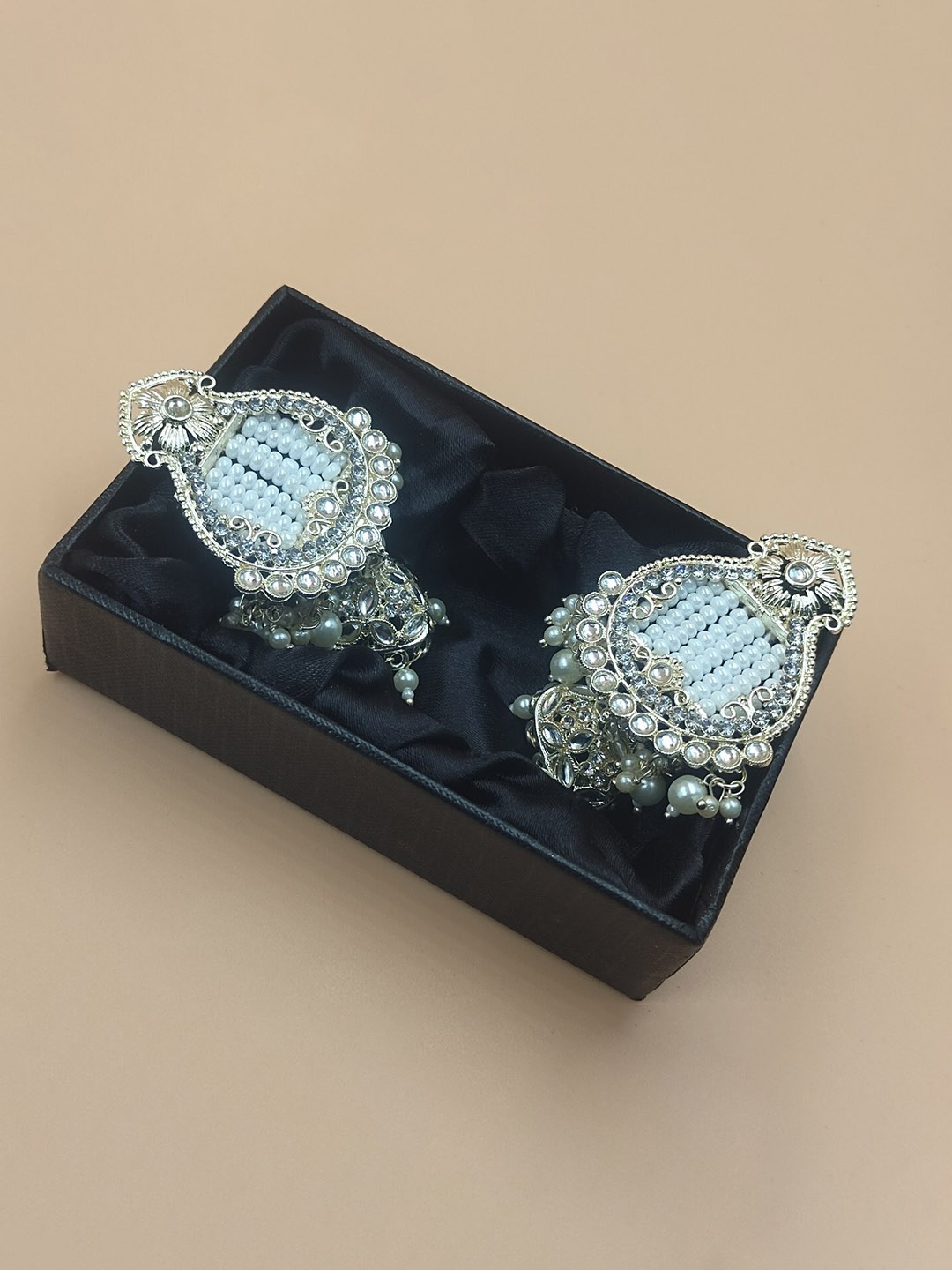 

Rhymee Gold-Plated Contemporary Kundan Studded And Beaded Jhumkas