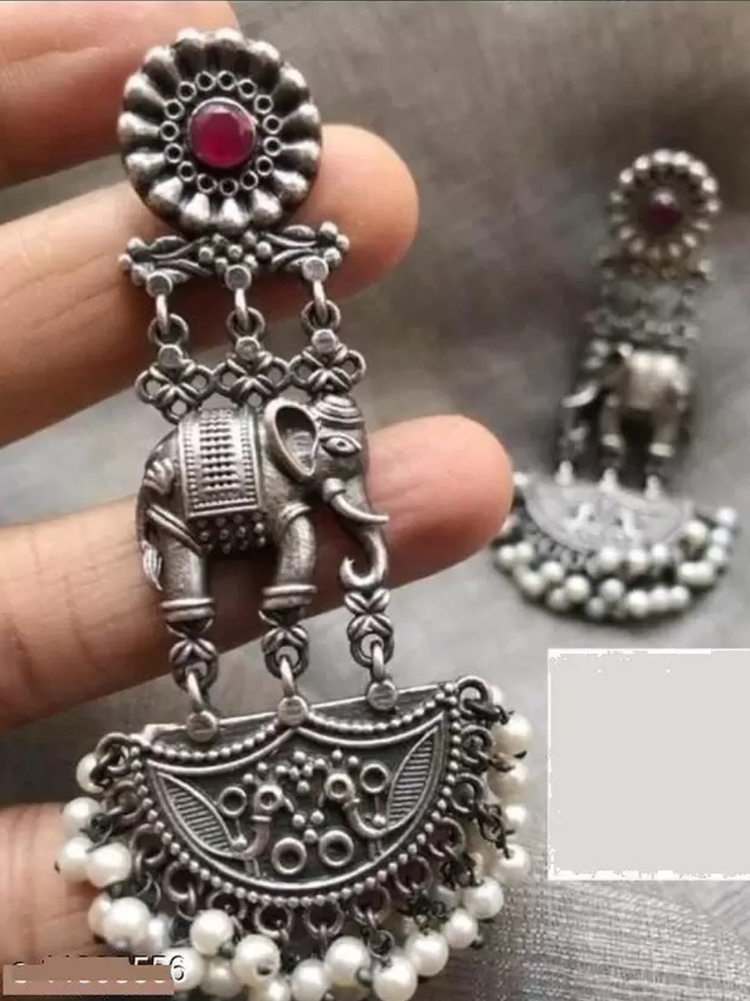

Samridhi DC Silver-Plated Oxidised Contemporary Drop Earrings