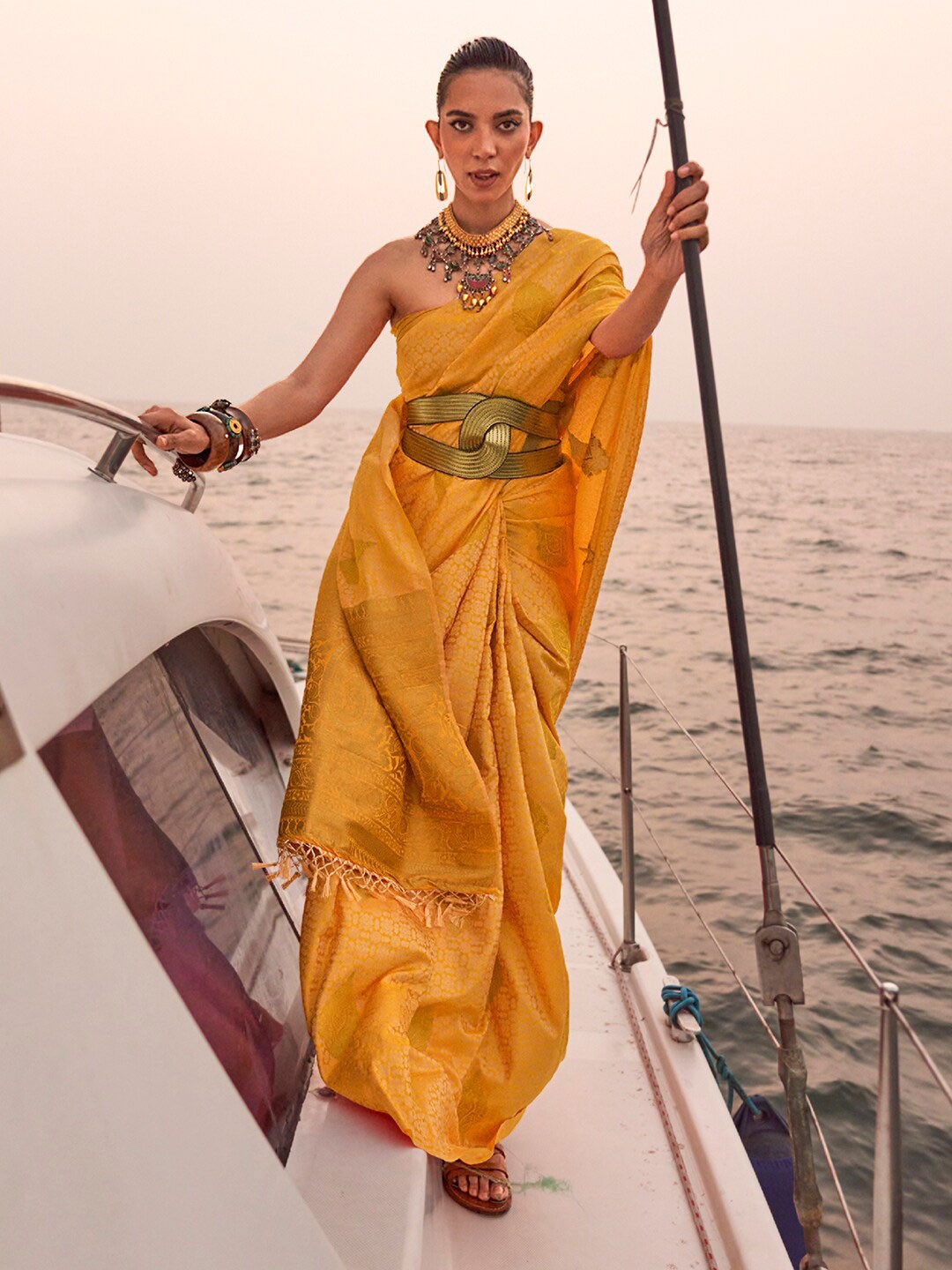 

Mitera Yellow & Gold-Toned Ethnic Motifs Woven Design Zari Banarasi Saree