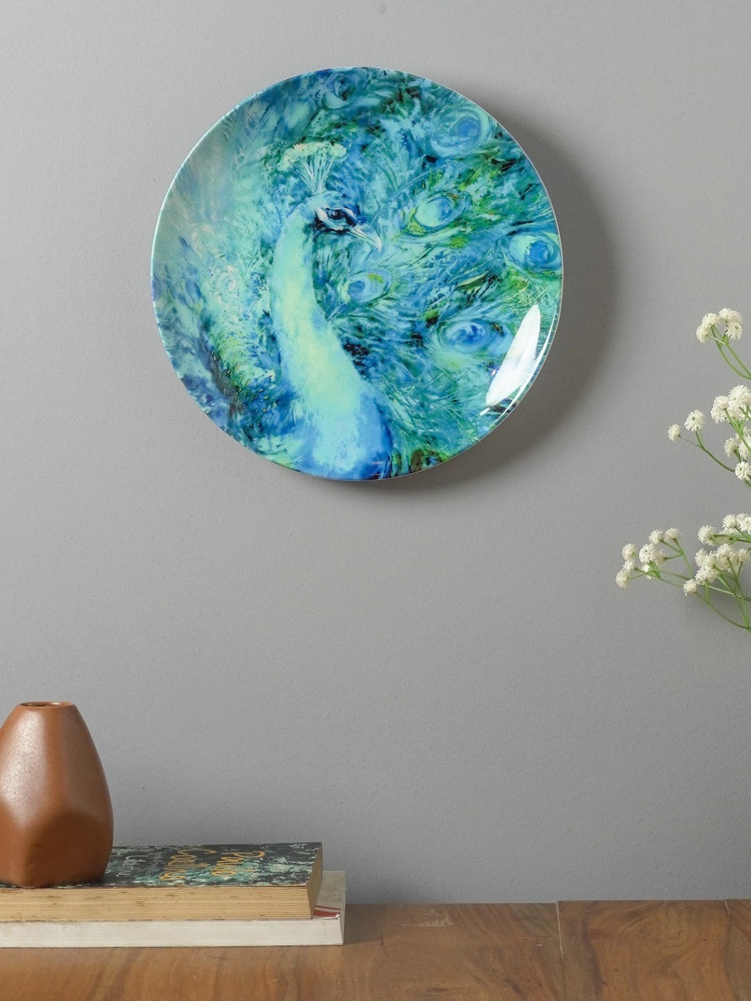 

The Decor Mart Blue Printed Peacock Ceramic Wall Plate