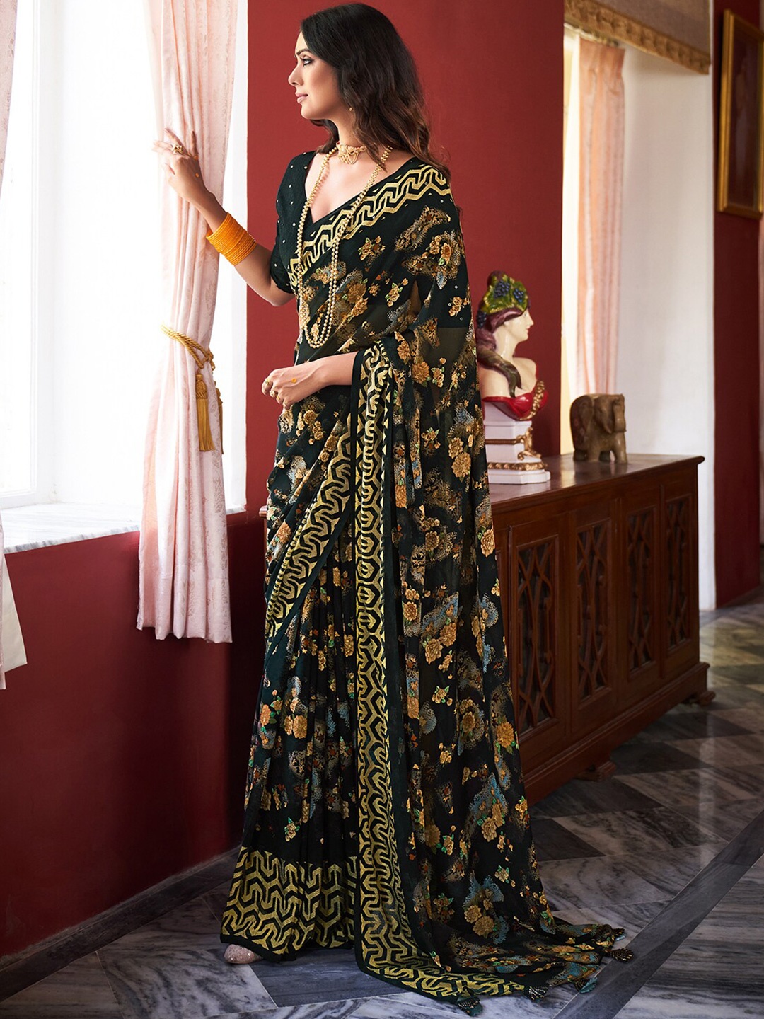 

Saree mall Black & Yellow Floral Pure Georgette Sarees