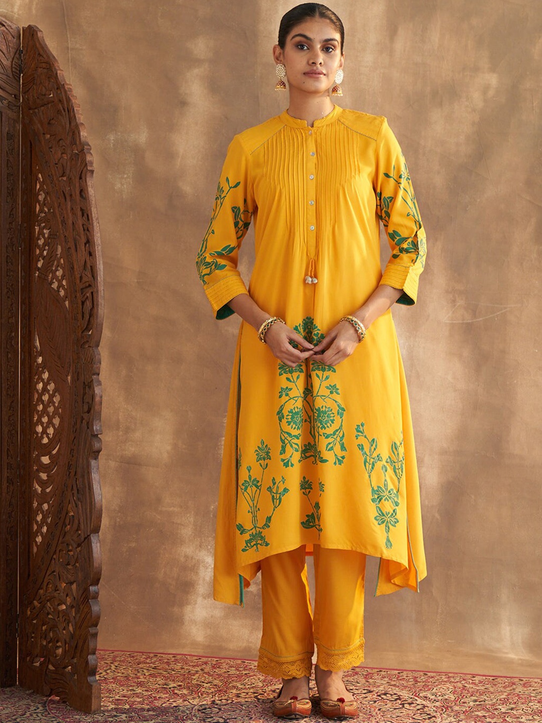 

Lakshita Ethnic Motifs Printed Pleated A-Line Asymmetric Kurta with Trousers, Mustard