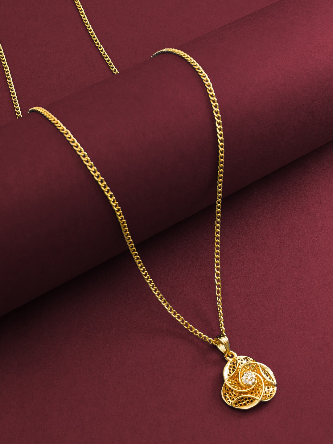 

aadita Gold-Plated Stone-Studded Flower Shaped Pendant With Chain