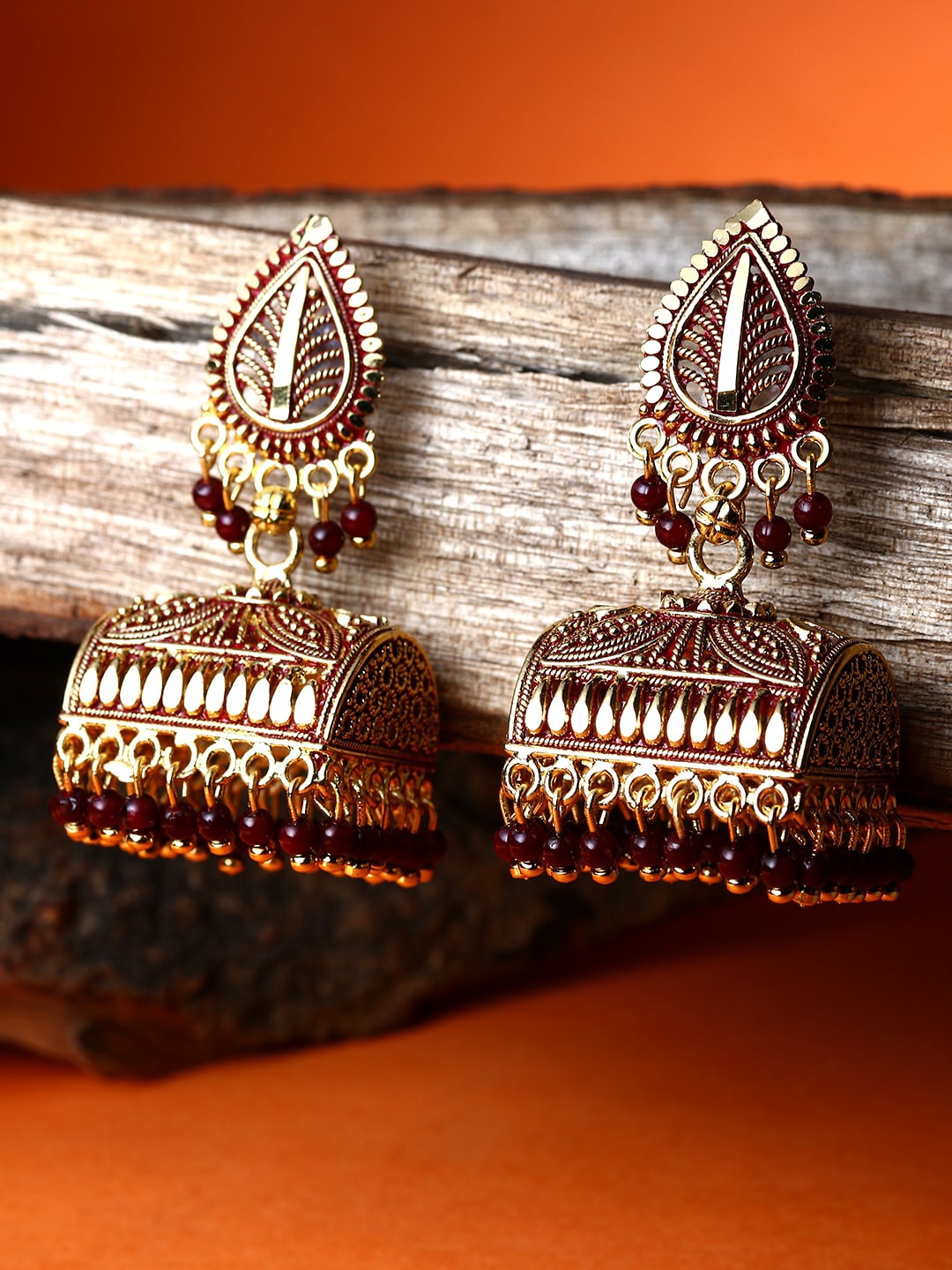 

ANIKAS CREATION Gold-Plated Leaf Shaped Jhumkas